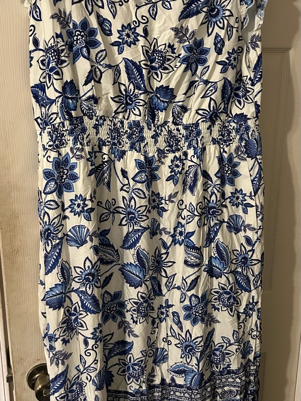 Blue and white dress new with tags. It is a Midi.